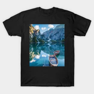 Calm boats in a lake through the mountains T-Shirt
